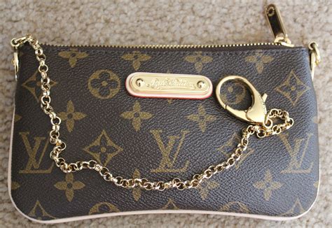 fake louis vuitton wristlet clutch|louis vuitton used clutch.